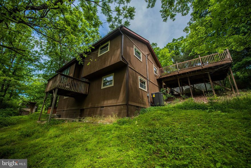 AMAZING park like setting, large deck connected to above ground pool. Overlooking year round creek. Enjoy your hot tub in complete privacy. This home was originally built as a split foyer with much added on Including the huge bonus room. Large 23x23 detached garage that is heated with 220 amp electric service. Kids can enjoy there own play house. New heat pump, New appliances.