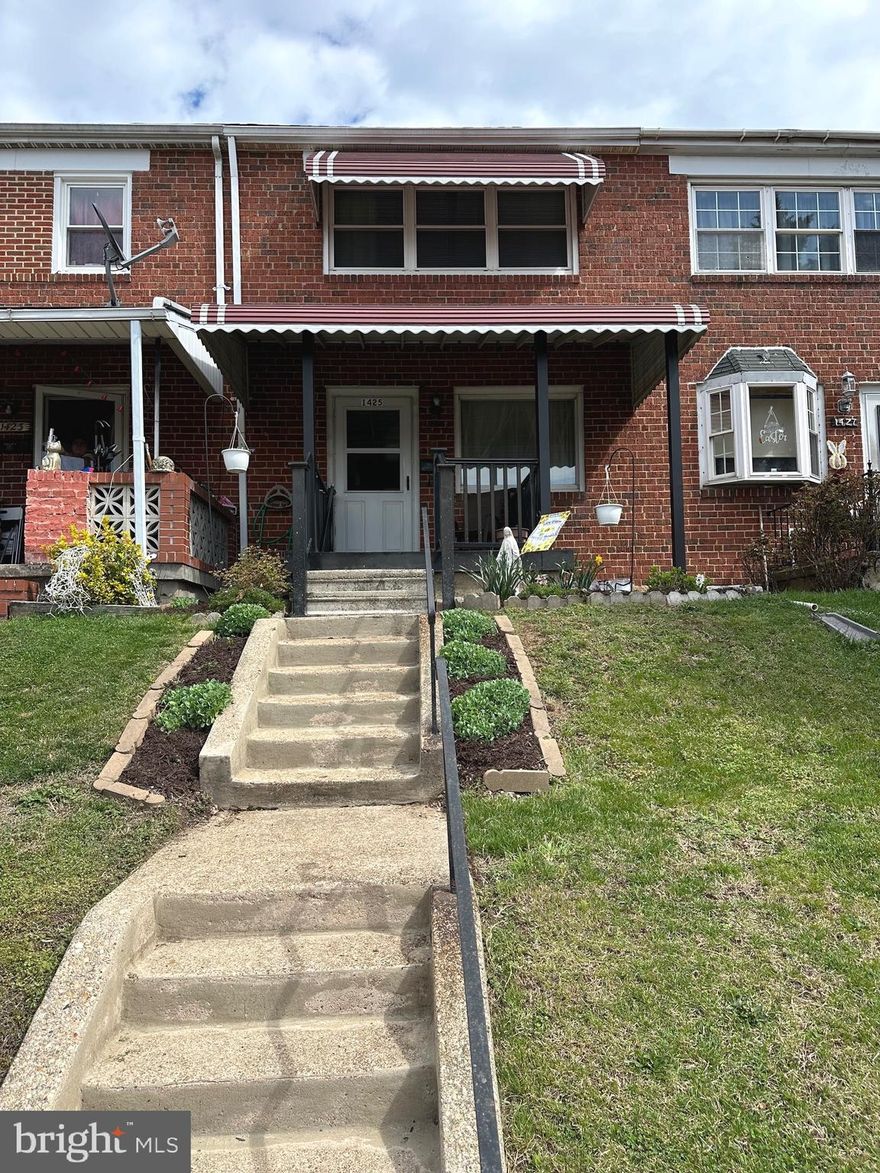 This well loved brick 3 bedroom and 1.5 bath row home with fenced in back yard, is for sale for the first time!  A lovely covered, composite, front porch and off-street parking behind the house, this home has a finished basement with half bath, laundry, and entrance to back yard and 2 sump pumps. The original Harwood Floors exist under the carpet in the living room and the entire upstairs. Upper level has three bedrooms, linen closet and full bath. Schedule your appointment today