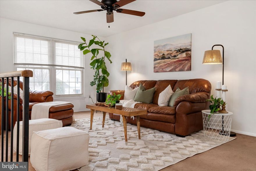 CHARMING duplex that truly lives larger than it looks ! This is a hidden GEM in the heart of Four Seasons Estates with NO HOA! From the extended driveway that comfortably fits two cars to the deep one-car garage offering impressive storage, this home immediately stands out!  Step inside to a freshly updated upper level that feels crisp and refreshed. The main living area greets you at the top of the stairs and flows into a bright kitchen featuring updated cabinetry, black appliances, newer flooring, and a spacious eat-in area perfect for everyday dining.  Generous primary bedroom with access to a beautifully renovated shared bath, plus a second bedroom. The lower level expands your options with a third bedroom, half bath, dedicated laundry area, and a versatile recreation space ideal for movie nights, a playroom, home office, or gym. Sliding glass doors lead to a large patio and one of the biggest fully fenced lots around, complete with a sizable shed for even more storage!  Garage access is conveniently located on the lower level as well. With a newer roof and walk-ability to Four Seasons Elementary, PLUS a central location near Fort Meade, DC, Annapolis, and Baltimore, this home combines comfort, flexibility, and an unbeatable location in one exceptional package! OPEN HOUSE THIS SATURDAY 12-2 PM!!! Come on by!