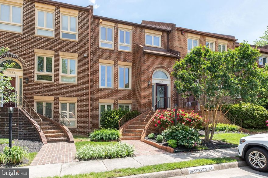Wow is the perfect description about this beautiful townhome that has been remodeled top to bottom with modern/ contemporary upgrades and finishes. Large brick townhome with three finished levels offer 4 bedrooms & 3.5 baths. Minutes to I-66, VIENNA METRO  & OAKTON HIGH***This property has it all- Location, Amenities (community swimming pool) & Top school district. Inviting two story foyer leads to main level living room with lots of windows offering tons of natural light! Gleaming wood floors throughout all three levels! Gourmet kitchen has Quartz countertop, stainless steel appliances, white modern cabinets & butler's pantry with breakfast area***Upper level features owner's suite w/ walk-in closet, fully renovated primary bathroom, two other "generous size" bedrooms & beautifully renovated hallway bathroom***Finished basement boasts bedroom, full bathroom, large laundry room, and spacious family room with fireplace, wet bar, and walkout to private patio backing to green space***Updates include new roof, new window, new HVAC, all bathrooms, kitchen, recessed lighting & much more!