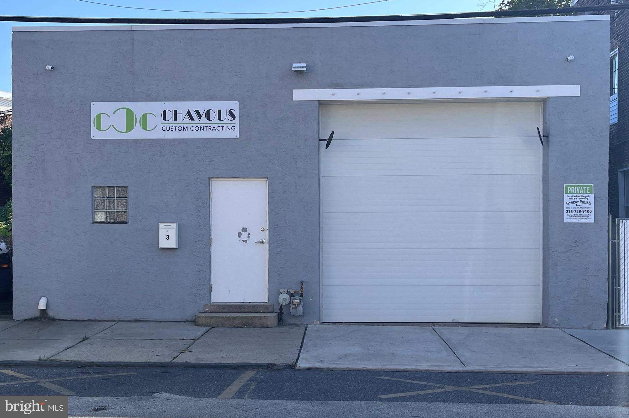 Impeccably maintained large warehouse perfect for a general contractor or any member of the trades. This space features front and rear 12'x12' automatic commercial grade overhead doors for entry and access to the paved rear of the fenced-in property. The interior of the building features a spacious office and supply closet, a half bath and plenty of space for shelving and storage of commercial supplies and equipment. Newly installed exterior 4'x20' elevated concrete walkway flush with the rear blacktop with 6ft privacy slatted chain link fence, a security camera, hinged barb wire chain link gate, and full access from the rear black top. Provides additional secure exterior storage space. Newer rubber roof, new fencing, and an interior/exterior security system make this property move-in ready.