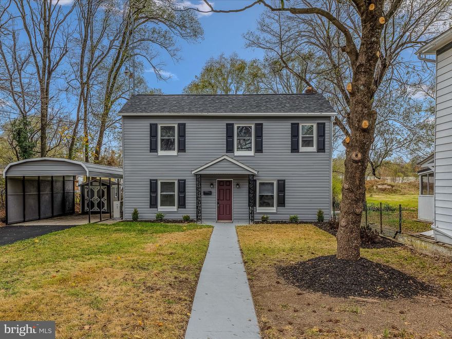 This lovely colonial has been updated throughout and has tons of curb appeal! The large front yard is lush with grass and features mature trees. The long driveway provides ample off-street parking for you and guests. The carport will keep you out of the rain. Inside you have a spacious dining room with LVP floors and bright windows. It is open to your kitchen. Here you have a large island for prep and storage space. The cabinets are the much sought after white shaker. These are accented by granite countertops and stainless steel appliances. A cased archway leads from your dining to the large living room with LVP floors and overhead LED light. Great set up for entertaining, especially with holidays approaching! The main level bathroom houses your stacked laundry and features LVT floors, 3 ft single bowl vanity and large shower. There is a convenient mudroom with your utilities. Upstairs you have a large primary suite with LVP floors and walk-in closet. The private ensuite features LVT floors, 3 ft vanity for ample storage, and 5 ft acrylic tub/shower. Bedroom 2 features bright windows, LVP floors, and a large closet. Outside in the rear of the home you have a large concrete patio for those summer BBQs. This home offers the single family space you've been looking for at a price you can afford! Schedule your showing today!