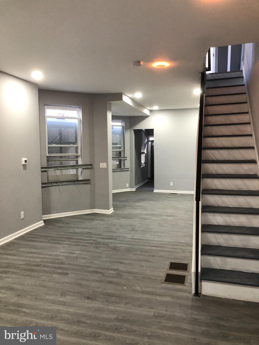 Introducing 1725 N 25th St, conveniently located near the intersection of 23rd and Ridge Ave. This recently renovated home offers 5 spacious bedrooms and two and a half brand-new bathrooms, each adorned with beautiful subway tile. The kitchen features new white shaker cabinets, ample counter space, and brand-new stainless steel appliances, making meal preparation a breeze. Bright and open rooms flood with natural light through large windows, providing plenty of storage space. Laundry hookups are available in the basement for added convenience. With central air for both heating and cooling, this home offers modern comfort for its residents. Don't miss the chance to be the first to live in this beautifully renovated space!