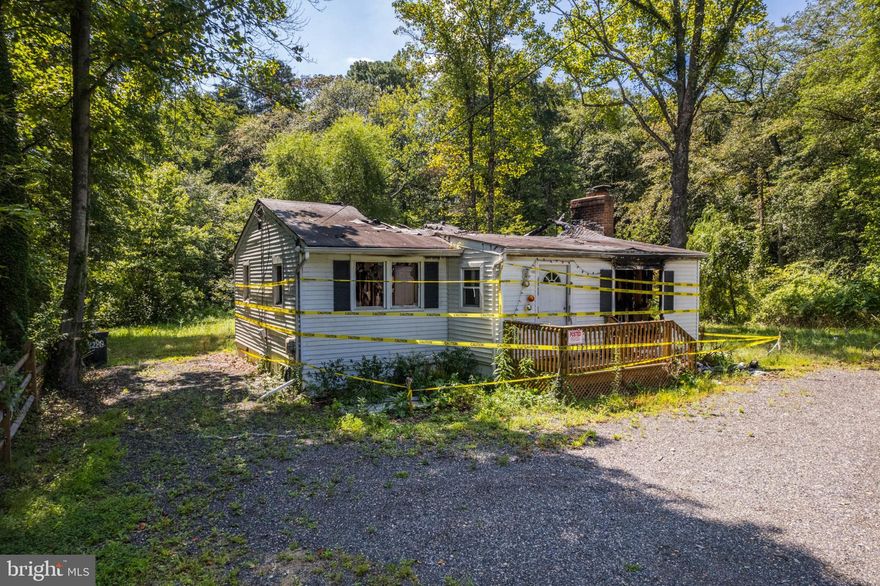 FIRE SALE - Investment Property / Potential for total tear-down and new construction or to construct a modular home on the existing foundation. Avoid most impact fees by documenting existing structure for new permit. Existing Artesian Well, Existing Septic System, and Electric already to site. Property located on a private .92 acre lot, within 30 minutes of BWI, NSA, Baltimore and 2 miles from many major stores. Backs to to woods and a stream, SOLD AS IS -- BUYER TO VERIFY PERMITTING PROCESS WITH THE COUNTY.
DO NOT GO IN THE HOUSE!!!