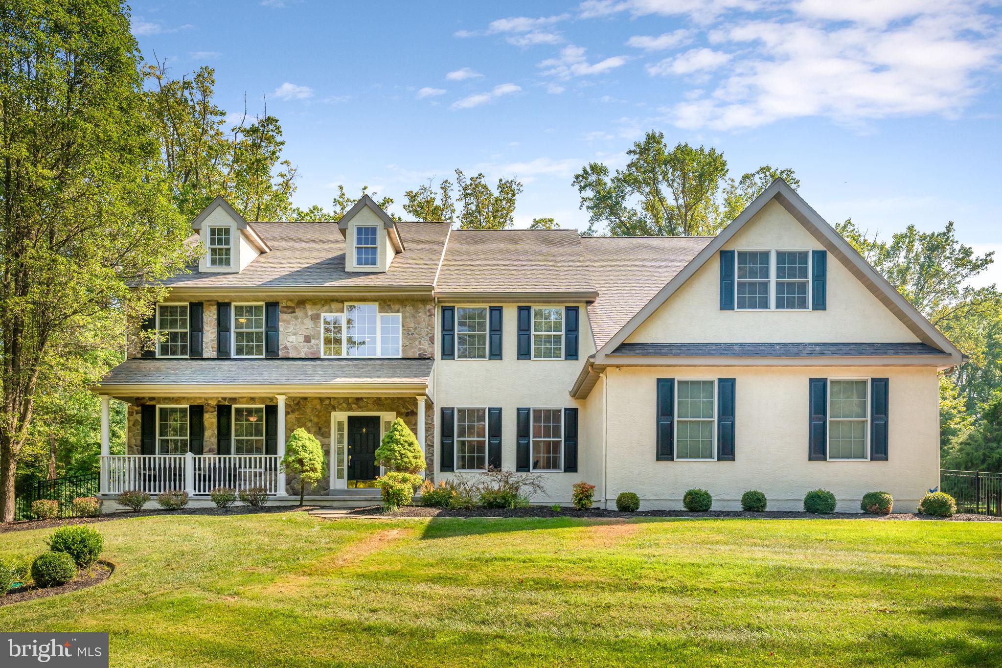 Quick settlement possible! Welcome to 4 Wildwood Drive, a true 5-bedroom, 4.5-bathroom home in the award-winning Great Valley School District! This home is situated on a partially wooded, 2-acre, level lot in the Willistown Acres neighborhood. Via the slate walkway, you’re greeted by the classic front with stone and stucco exterior with contrasting black shutters. The covered front porch is perfect for peaceful morning coffee or evening drinks. Enter into the spacious foyer with cathedral ceiling and a grand staircase with wrought iron spindles. The marble tile floor spans the foyer with beautiful millwork and access to the entry coat closet and the half bathroom. On the left is the formal living room with hardwood floors that span the remainder of the first floor and a beautiful tray ceiling. Solid double French doors provide access to the private 1st-floor home office with recessed lighting A second set of double, lighted, French doors open to the heart of the home, the family room and kitchen. Back in the entry way, on the right is the dining room with chair rail, coffered ceiling and a wine refrigerator, perfect for entertaining. From the dining room, enter the eat-in kitchen with a large island with breakfast bar, granite counter tops, stainless steel appliances, propane cooking, and double Bosch ovens and a large pantry. From the kitchen, sliding glass doors provide access to the rear deck with steps down to the large fenced yard. Adjacent to the kitchen is the family room with vaulted ceiling and marble-surround, wood-burning fireplace with a picture window which allows for ample sunlight. Down the hall from the kitchen is the sunroom with tile floor, perfect for a relaxing morning coffee or for the houseplant enthusiast. The first floor is completed by the mud room with storage cabinets and a sink and with access to the 3-car garage. Upstairs to the bedroom level, you’ll find continuation of the hardwood floors throughout. The primary suite offers a spacious bedroom with vaulted ceiling, large walk-in closet and an en suite bathroom with oversized tiled shower with frameless glass doors, double vanities, soaking tub, a water closet and a linen closet. The 2nd and 3rd bedrooms both with ceiling fans and hardwood floors are serviced by a Jack & Jill bathroom with double vanity and tub/shower. The 4th and 5th bedrooms are served by the full hall bathroom with tub/shower and single vanity. The lower level, accessed via a lighted door from the foyer, is fantastic finished space with vinyl plank flooring, multiple spaces that can serve as a play area, den, and workout area. There is an additional private room that could be an overflow sleeping area or a second home office as you need. The lower level also offers a full bathroom with corner shower and single vanity as well as an unfinished storage area. The exterior can be accessed via steps that walk up to the yard via Bilco doors. The home has a generator, dual zoned for air HVAC as well as hot water baseboard heat. 4 Wildwood Dr is a beautifully updated, move-in ready property just minutes from Malvern Borough restaurants, shopping, and the Paoli-Thorndale Line to Philadelphia. Schedule your appointment today for this beauty.