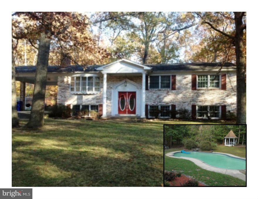 Stunning!! Approx 2,900 s/f Split Foyer, all new kitchen, baths,tile, stacked stone Fire place w/ built in for TV, etc. Large Laundry w/ cabinetry, folding counter, trex multilevel decking, in ground pool, detached 3 bay garage/work shop, beautiful level 1.8 acre lot, AWESOME LOCATION with easy access to 210 or 301. Home shows well, Friendly Gold Retriever "Marley" don't let out.