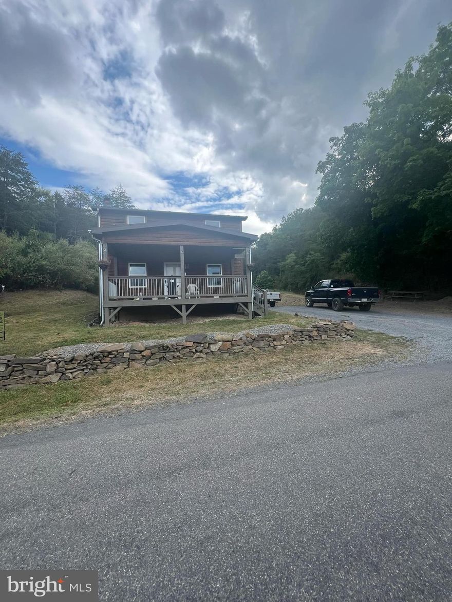 What a great find ! Current owner completely gutted and re-built this beautiful home from the ground up ! This spectacular 3/1  home boasts 1300 sq ft ,large outbuilding /workshop w/ built-in dog kennel well-situated on 2.64 acres with easy access off hardcap S. Fork of Little Cacapon Rd in the geographical center of Hampshire Co. WV . Property also features new electric, new roof,chimney, counter tops/kitchen, laundry room, shower, commode and is turn-key ready for the lucky new owner to enjoy on day 1 !  Should go any type of loan program but see this one first! It is will most likely not last long at this price and some lucky new owner will get a fantastic property at a good price !!