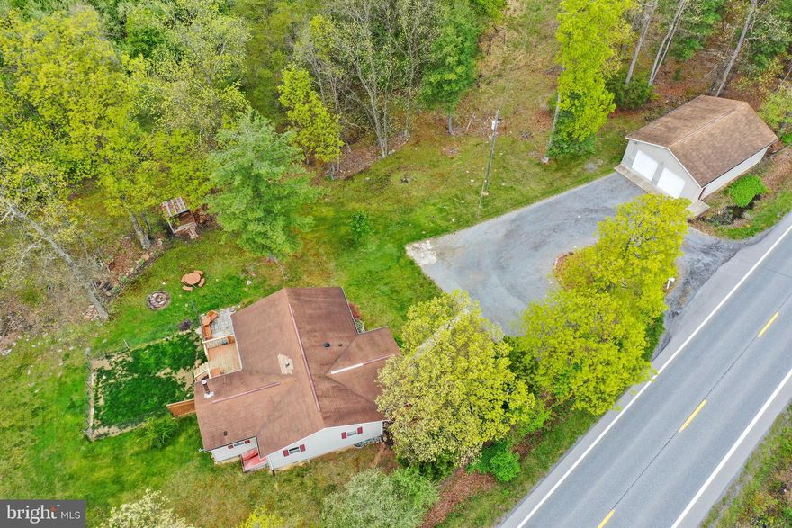 Here is a great opportunity to own a 1312 sq. ft home for $229,000.00 on almost a half an acre.  Locate right off of Rt 522 by the VA line.  3 bedroom, 2 full bathroom, large 15x18 living room, dining area, full kitchen, separate laundry room, mudroom with wood burning stove. Outside you'll enjoy relaxing on the covered front porch, nice back deck and patio area.  The house is nicely landscaped.  HUGE 1000 sq. ft. detached garage with 9ft doors.  Close to Cacapon State Park with golfing, fishing, swimming at the lake, tennis, basketball,  nature center and hiking trails, spa, and catch a bite to eat at the restaurant and more!
 I have multiple offers. Highest and Best due by May 5th.