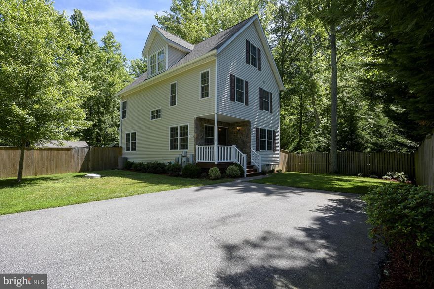 4 bedroom, 3.5 bath, 3 LEVEL home in Waterfront community with boat ramps, marinas & beach. Easy access to Chesapeake Bay.  Spacious levels.  Large Master bedroom with walk in closet & master bathroom. 3rd level offers family room, full bathroom & 4th bedroom.  Lots of storage on 3rd level.  Great deck, 2nd floor laundry, duel zone HVAC, storage shed. Blue Ribbon Schools. Lot behind unbuildable PS