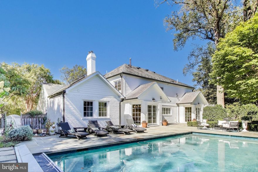 Stunning from top to bottom, this fully renovated residence at 6017 Shady Oak Lane in Kenwood Park is a true showstopper. Nestled on a private lot, the home offers exceptional outdoor living with a pool, lush landscaping, and an expansive entertaining patio—perfect for relaxing or hosting. The home’s curb appeal is enhanced by a slate roof, circular driveway, and mature greenery that provides a serene sense of seclusion.

Inside, no detail has been overlooked in this comprehensive renovation. The main level features a beautiful custom kitchen with high-end appliances, two fireplaces, and gorgeous floor-to-ceiling windows that flood the space with natural light. Throughout the first and second floors, stunning white oak floors add warmth and elegance, while a conveniently located full bath provides easy access from the pool.

Upstairs, the luxurious primary suite boasts a spa-like bath with heated floors and generous walk-in closets, creating a true retreat. A second bedroom includes its own ensuite bath, while two additional bedrooms are served by another full hall bath.

The lower level offers a private guest suite with its own entrance—ideal for visitors, an au pair, or in-laws—along with flexible space for recreation or a home office.

With thoughtful design, modern finishes, and a layout built for both comfort and entertaining, this home has it all. Ideally located just minutes to downtown Bethesda, DC, I-495, and in the sought-after Whitman High School cluster. WELCOME HOME.

Square footage is approximate and should not be used for property valuation.