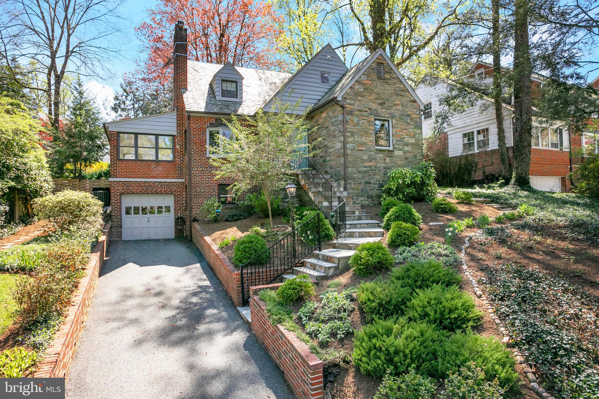 Welcome to this renovated Chevy Chase classic residence in picturesque Rollingwood. The overwhelmingly beautiful hilltop view offers natural light to fill the residence throughout the day. There are carefully selected design elements on all levels which incorporate modern amenities, open space and classic beauty. This residence radiates quiet luxury on a beautiful scale. Be sure to note, the main level open floor plan with a renovated kitchen for gatherings, and a main floor bedroom/office with a a renovated in suite bath. Entertain with ease on the landscaped backyard patio overlooking mature and lush gardens. The second level also includes a gorgeous renovated full bath as well as a light filled nursery large enough for king bed and large master bedroom with ample storage. The master bedroom windows offer a lovely view of the expertly landscaped backyard.
The basement level does not disappoint with a half bath, lovely entertaining space and fireplace. Rock Creek Park is mere steps away and offers endless possibilities for outdoor enjoyment. Historic Meadowbrook Stables & Candy Cane City are certainly places to visit and are within easy reach. There's even a metro bus stop a few doors away on Leland Street. Convenient to all 3 major airports and DC.