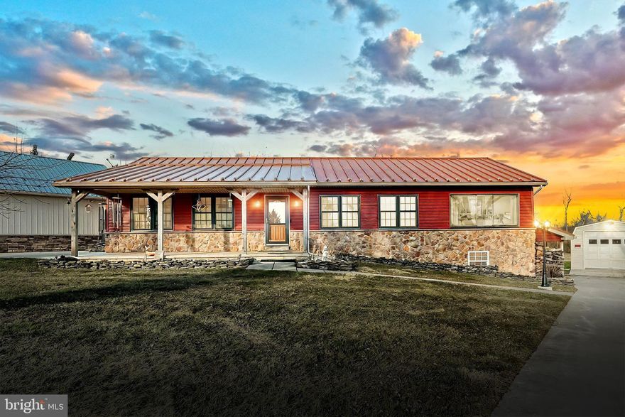 Offers received.  Open Houses cancelled. Calling all garage enthusiasts! If you love space for your vehicles, RVs, boats, storage, home gym, game room, or even an indoor sports area—this property is for you! With over 2200 sqft of garage space, this building features two separate garages, a recreation room, a full bath, and a spacious attic. Plus, everything is heated and cooled for your comfort, and a separately metered 220 service is in place to power your projects. But that’s not all! A separate 14x28 garage with electric and a 13x20 shed with electric offer even more storage and workspace, all accessible via a 2nd dedicated driveway. When you're done enjoying all that incredible space, step inside the beautifully updated 4-bedroom rancher. This home has been meticulously maintained and is move-in ready with a standing seam metal roof, new heat pump with propane backup, air conditioner, hot water heater, windows, and siding—all recently upgraded for peace of mind. With two finished levels, this home also offers in-law suite potential.  There are  two kitchens, three full baths, three laundry hookups, and plenty of room to spread out. Enjoy the outdoors on the 16x20 deck, and take advantage of the ample concrete surfaces for extra parking and recreation. Don’t miss this rare opportunity to own a home that truly has it all—space, upgrades, and endless possibilities!