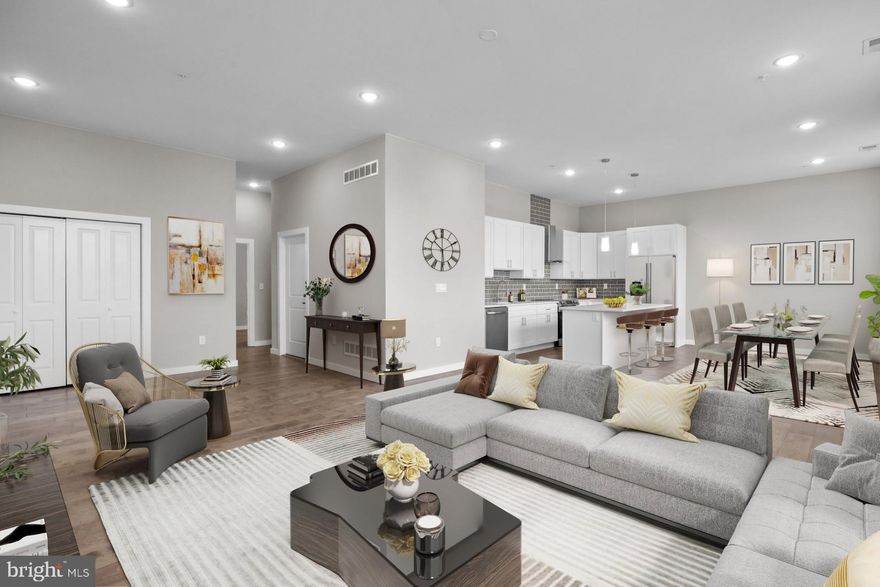 Welcome to Historic Bristol Boro and Jefferson Planned Community! Don't miss on new luxurious condo units in Historic Bristol Borough. This impressive 1576 sq ft., 2-bedroom and office unit features an open floor plan, 10’ feet ceilings, hardwood floors throughout and LARGE STORAGE UNIT in a basement. The open-concept design is curated for seamless entertaining, with a layout that effortlessly flows from the kitchen to the living area. The Living Area has an abundance of natural light through the large windows. Thoughtfully designed, this floor plan features 2 graciously sized Bedrooms and two Full Bathrooms. The kitchen has white cabinetry with quartz countertops, a tile backsplash, stainless appliances, wine cooler and an island separating the dining area. There is a large laundry room off the hallway with porcelain tile floor. Bathrooms feature modern vanities, porcelain tiles and plenty of space. This large units offers 2 bedrooms and 2 full baths with one of each completing the master suite. The master suite showcases a spacious bedroom, private bath and office or work out room. The private bath has a beautiful custom tile shower with a glass enclosure, double bowl modern vanity and porcelain tile on the floor. The hall bathroom complements the master bathroom with similarly impressive tile and fixtures. This unit has LED recessed lighting throughout, electric heater, central A/C, vinyl double-hung windows and comes with 2 assigned parking spaces. The HOA parking lot also offers additional 8 visitors parking spaces for residents' guests. This beautiful new unit located in the middle of Historic Bristol Borough, close to Mill Street and the riverfront, and just a few blocks to the baseball fields and recreation area.