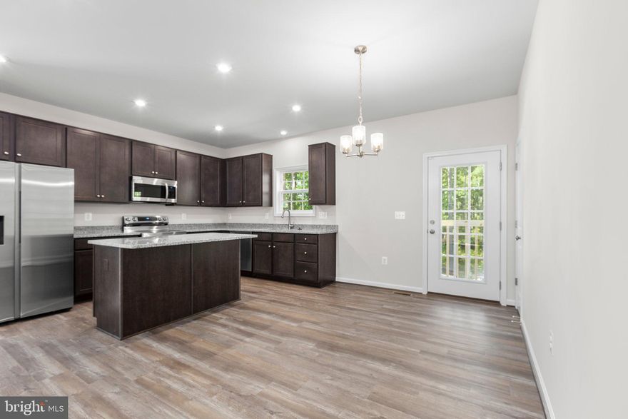 MOVE IN READY!
2 -Acre Homesite in Pleasant Valley Estates – Immediate Move-In

Homesite 4
- 1,532 sq. ft. with 3 bedrooms and 2 bathrooms
- Open layout with spacious living area
- Eat-in Aristokraft kitchen with Birch Benton Flagstone cabinets and Luna Pearl granite countertops
- Owner’s suite with walk-in closet and dual-sink vanity
- Additional two bedrooms, full bath, and laundry room

Nestled in a peaceful, wooded setting, Pleasant Valley Estates offers 2 to 4-acre homesites just minutes from Lake Anna, Fredericksburg, and Culpeper. Enjoy privacy, space, and natural beauty—all conveniently close to shopping, dining, and recreation, without the bustle of city living.

The Ella is a charming single-family home designed for easy main-level living. Its open layout features a spacious living area and an eat-in kitchen with plenty of storage, counterspace, and an optional island. The owner’s suite includes a walk-in closet and dual-sink vanity, while two additional bedrooms, a full bath, and laundry room complete the home.