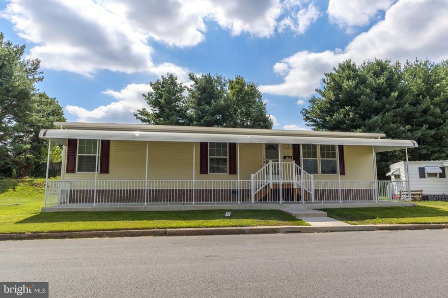 This well-maintained manufactured home, built in 2021, features two cozy bedrooms and two full bathrooms, offering ample space for relaxation and comfort. The inviting exterior boasts a lovely awning and a patio, perfect for enjoying warm evenings outdoors. Nestled in a vibrant neighborhood, residents benefit from nearby parks, walking trails, and local amenities that foster a sense of community. Enjoy easy access to essential public services and well-regarded schools, enhancing the quality of life for all. With assigned parking for convenience and a shed for extra storage, this home is both practical and welcoming. Experience the warmth of Village Green, where neighbors become friends and every day feels like a retreat. Embrace a lifestyle of comfort and connection in this delightful home!
