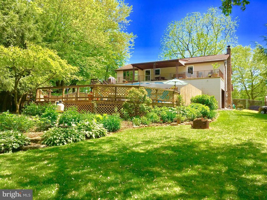 POOLS OPEN  and waiting for you, your family and friends. This paradise can be just out your back door.The beautiful, private backyard offers private quiet relaxation when you want it and with the deck just off the kitchen you can easily refill your cup or glass. Venture off the deck to the numerous spots for relaxing and planning your upcoming event when these same spaces, decks and the pool provide you the best private parties and when the party's  over your paradise transforms back to the spot to appreciate the memories you have created. There are other homes that offer 3 bedrooms, 2 baths and a 2 car garage, but this home offers you the spot to effortlessly   create fantastic memories for all you invite and it is all hidden in back of this home. This is the place, come see for yourself, you will be smiling as you discover every aspect of this paradise.