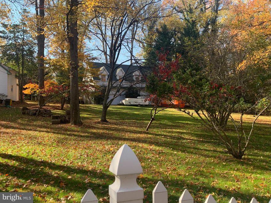 Gorgeous  1/2 acre lot on a private side street in highly desirable Annapolis Roads.  Rare opportunity and priced right!   There is currently a huge 3 car garage on the rear of the property.  Annapolis Roads community has so much to offer including a sandy beach, boat ramp, pier, kayak rack, playground,  picnic tables 33 acres of walking and jogging trails.