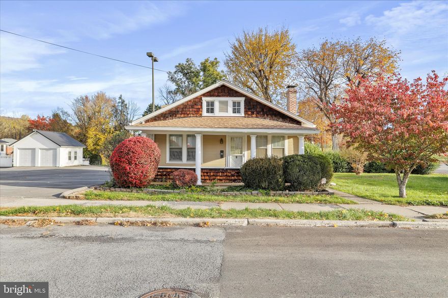 There are houses that hold memories, and then there are the ones that shape them. This home is one of those rare places. I grew up here, and even now, every time I walk through the front door, I’m reminded why homes built in this era still matter. They were built with care, made to last, and designed for everyday living. Set in the heart of Romney, the home sits just across from the West Virginia Schools for the Deaf and the Blind. The campus stretches wide and open—acres of green lawns, shade trees, and historic brick buildings that have watched over generations of students. It’s one of the most peaceful and recognizable settings in town. From the porch, you can see the landscape change with the seasons and feel the calm that seems to settle over the neighborhood. Inside, the home has an easy, natural flow—hardwood floors, arched transitions, and rooms filled with soft morning light. It’s simple in the best way: three bedrooms, one bath, a spacious kitchen, and a full basement that has stored decades of projects, memories, and laughter. There’s nothing flashy about it, and that’s part of its appeal. Outside, the corner lot offers a generous yard framed by mature trees, perfect for gardening, gathering, or just enjoying the day. Everything about this home feels honest—the craftsmanship, the setting, the way it’s woven into the fabric of Romney itself. Homes like this don’t just represent square footage or style. They represent a time when things were built with purpose and families stayed put long enough to really know their neighbors. It’s a place that feels like West Virginia—welcoming, grounded, and full of heart.