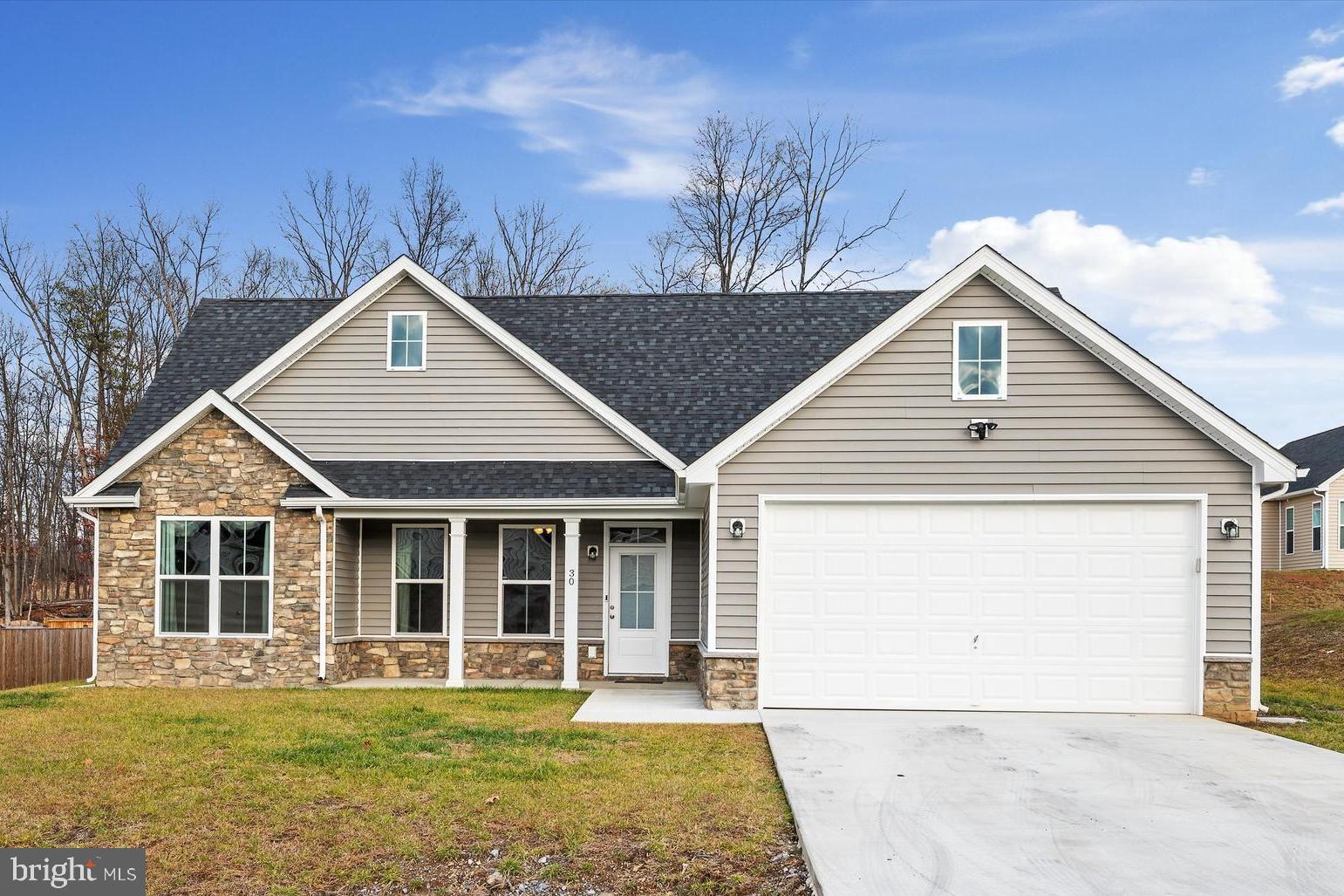 LIKE NEW ranch home with 1712 sq of living area. Large owner's suite with a trey ceiling, ceiling fan, walk in closet plus an additional closet, gorgeous owner's full bath with tiled flooring and an oversized tiled shower with double headed shower heads, vanity with two sinks. Family room with cathedral ceiling, recessed lighting that is open to kitchen and dining area. Upgraded kitchen cabinets with island, granite counter tops, stainless steel appliances, soft close cabinets with built in pantry. Enjoy sitting by the fireplace in the 14x16 Sunroom with a cathedral ceiling that has access to the large patio. Lovely LVP flooring and carpeted bedrooms. Lots of nice feaures to enjoy outside ... Covered front porch, large flat yard with a rear patio and privacy fenced back yard. Large attached garage with extra storage space and an automatic garage door opener.