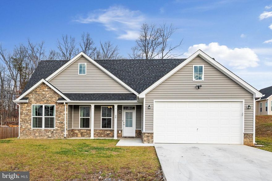 LIKE NEW ranch home with 1712 sq of living area.  Large owner's suite with a trey ceiling, ceiling fan, walk in closet plus an additional closet, gorgeous owner's full bath with tiled flooring and an oversized tiled shower with double headed shower heads, vanity with two sinks.  Family room with cathedral ceiling, recessed lighting that is open to kitchen and dining area.  Upgraded kitchen cabinets with island, granite counter tops, stainless steel appliances, soft close cabinets with built in pantry.  Enjoy sitting by the fireplace in the 14x16 Sunroom with a cathedral ceiling that has access to the large patio.  Lovely LVP flooring and carpeted bedrooms.  Lots of nice feaures to enjoy outside ... Covered front porch, large flat yard with a rear patio and privacy fenced back yard. Large attached garage with extra storage space and an automatic garage door opener.