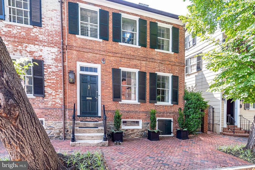 Complete renovation, all the bells and whistles, and 2300 Square feet on two levels!  A unique opportunity to own a fabulously chic historic home in the heart of historic Old Town Alexandria! A stunning renovation completed in 2014 created a luxurious modern presentation with high-end finishes behind a classic Federal façade. Easy living on 2 levels, light filled, open floor plan with welcoming marble foyer with curved wall, radiant heated floors and more!  Spectacular gourmet kitchen featuring sleek cabinets, honed Calacatta marble counters, Wolf and Sub-Zero appliances, Modern-Aire barrel range hood, built-in Miele coffee/espresso machine and U-Line beverage refrigerator. This exquisite offering boasts three gas fireplaces including a Spark Modern ribbon fireplace in the kitchen and a relined 18th c. chimney in the living room. Two spa-like full baths feature heated floors, double sinks, floating cabinets, large showers with bench and double shower heads and a separate water closet.  The primary bedroom suite offers a dramatic vaulted ceiling, abundant functional closet space and a gas fireplace. Separate laundry room is located on the bedroom level.  Absolutely gorgeous private patio space perfect for alfresco dining and includes a gas line for easy grilling. This truly special residence is conveniently located on a storied block of N. Fairfax Street, just 1 block from Market Square and King Street; a short stroll to parks and trails, this prime location affords easy access to Washington DC, National Airport, Amazon HQ2 and major commuter routes.