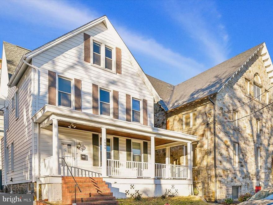 The former parsonage at 1000 W. 38th Street is being offered for the first time as its own standalone residence. A 2.5-story, aluminum-sided dwelling with abundant historic character, it has been newly established as an independent lot following the completed subdivision from the neighboring church property. Recordation of the Subdivision Plat and the creation of a new tax account for 1000 W. 38th Street are underway and expected to be finalized as part of the first sale and transfer. The property is being sold in as-is condition. Legally described as Ward 13, Section 2, Block 3563A, Lot B, the home offers 2,304 square feet of above-grade living space, with additional square footage in the full basement, all set on a 0.0529-acre lot. Lovingly and consistently maintained by Good Shepherd United Methodist Church throughout its stewardship, the home blends classic architectural charm with thoughtful, low-maintenance updates. A generous wraparound porch with composite flooring welcomes you and provides an inviting setting for everyday outdoor enjoyment. Durable, low-maintenance siding further enhances the home’s well-cared-for exterior. There is the possibility of on-site parking at the rear of the property if the existing fence is removed. Inside, the home reflects the proportions and craftsmanship expected of a residence of this era. Hardwood floors run throughout, adding warmth and authenticity to each room. With five bedrooms and one-and-a-half baths, the layout offers flexibility for a wide range of living needs. The full basement provides valuable storage and potential for expanded living or recreational use. While well preserved, the property also presents an excellent opportunity for its next owner to bring it seamlessly into the 21st century. A reimagined kitchen, updated baths, modern systems, and central air could elevate comfort while retaining the home’s original character and generous footprint. Good Shepherd United Methodist Church has long been a part of the Hampden community, known for its active involvement in neighborhood life and its commitment to inclusive outreach and community support. This residence played a meaningful role in that history, serving as the parsonage and contributing to the daily life of both the church and the surrounding area. Situated in a convenient Hampden location, the home offers close proximity to The Avenue, parks, dining, shops, and a wide array of local amenities. With its generous size, rich history, wraparound porch, and well-preserved character, 1000 W. 38th Street represents a unique opportunity to own a distinctive property in a central Baltimore neighborhood.