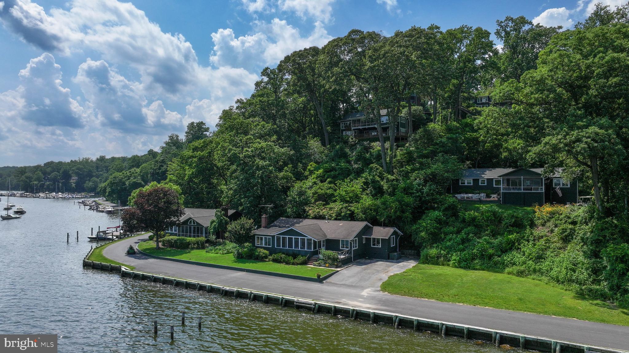 769 Robinhood Road is one of the most desirable Waterfront properties in Sherwood Forest. Uniquely situated on a point you will enjoy river breezes from your living room and front porch while experiencing stunning views of the Severn River Bridges into Annapolis and down the Idle toward the Sherwood Forest Marina. On a clear day you can see the Eastern Shore! Watch as sail boats, wind surfers and yachts cruise by your front porch. Another unique benefit of 769 is that, unlike many of the Sherwood properties, it has ample parking for 5+ cars. This 1 level, 3 bedroom, 2 bathroom home, has been in the same family since 1940. Included in the listing documents are a home inspection report, already developed building plans, and information about a brand new septic in the works. Home is being sold AS IS. Take advantage of the varied Club amenities while you savor one of the best views in all of Sherwood Forest.
**Sherwood Forest is a gated Community of 341 homes, situated on the Severn River. It's peninsula shape and sweeping elevations create gorgeous vistas of the surrounding creeks, river and the Severn River Bridge. **Walk along the 2 mile waterfront road and take in bridges framing the mouth of the Chesapeake Bay. **Bike or hike the 5 miles of outer Forest trails. Most residents prefer their Golf Carts for easily navigating the scenic hills. **Established in 1915, the Community is anchored by a grand nostalgic Clubhouse which overlooks the Community Pool - and houses a Dance Hall, Duckpin Bowling Alley, a Stage for Community Productions, a Grand Stone Fireplace, Library, and a Nature Lab for educating the children about Chesapeake life. Members enjoy many events at the Clubhouse including Community Dances, Anniversary Celebrations, and Cultural Arts Presentations. The Clubhouse is available to members to rent for Weddings or Private Events. ** The Sherwood Forest Market serves ready-made meals and stocks staples for your cottage kitchen. ** Sherwood is known for the Children's Summer camp where your children learn numerous activities including Sailing, Swimming and Archery. **Other outstanding amenities are a 9-Hole Golf Course, Tennis Courts, Pickleball Courts, Basketball Court, Badminton, Softball field and a Lacrosse/Soccer field. ** For the Chesapeake lovers, Sherwood has a Marina, a , Small Piers and a Main Pier where river swim meets are held. **Make memories with events like the 3rd of July Fireworks, 4th of July Parade and and Annual "not be be missed" Corn Roast. There are tennis, golf and pickleball tournaments for adults and children alike. *With a purchase of a home, Sherwood Forest requires a one-time $20,000 club membership fee.