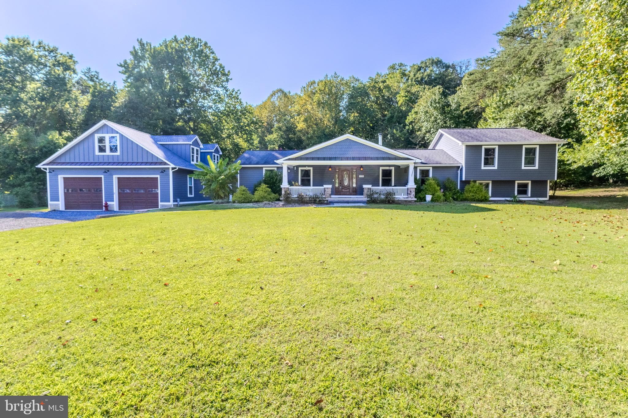 Where to begin? This Craftsman-style gem truly has it all—space, location, and potential!
Nestled on nearly an acre in the sought-after Cheval Trails Community of Davidsonville, this home offers the rare combination of expansive indoor living, peaceful outdoor space, and exceptional versatility.
Step inside to discover a bright and airy open-concept layout anchored by a massive living room addition (built in 2001) that’s perfect for entertaining or simply relaxing. The space flows effortlessly, creating a warm and inviting atmosphere that feels both spacious and connected.
Enjoy the serenity of nature as the home backs to mature trees—providing a private and peaceful setting. Whether sipping coffee on the huge front porch or hosting a summer gathering on the back patio, you’ll love the seamless indoor-outdoor lifestyle.
But the showstopper?
A detached garage like no other—approximately 34' x 50', this oversized space easily fits at least 4 vehicles and offers high ceilings and ample workshop space, making it a dream for hobbyists, car enthusiasts, or collectors. Even better, the upper level holds the potential to be finished into nearly 1,000 sq ft of bonus living space—ideal for a future in-law suite, guest apartment, or home office.
Don’t miss this rare opportunity to own a home with character, convenience, and room to grow—inside and out!