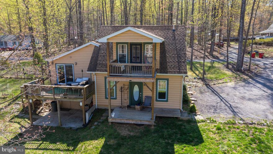 Welcome to your private woodland retreat—2+ ACRES, NO HOA!!! Endless freedom to live, grow, and explore. This one-of-a-kind 4-bedroom home blends rustic charm with thoughtful modern updates, creating the perfect haven for nature lovers, homesteaders, or anyone looking to escape the pace of city life.

Extensively renovated in 2016 (including multiple additions and a new septic system), the home features beautiful wood floors, exposed beams, and a light-filled open layout. The kitchen includes stainless steel appliances (dishwasher from 2023), and the cozy den offers built-in surround sound—perfect for movie nights, game days, or just unwinding with your favorite playlist. The primary suite is a true retreat with a jacuzzi tub, a custom wardrobe bench, and its own private balcony—perfect for slow mornings with coffee and birdsong.

Outside is where this property really shines. A newly renovated shed now serves as your personal spa space, complete with electricity, WiFi, and a woodstove sauna with soft, dim lighting. There’s even an outdoor cold bucket shower for the bold. The land is bursting with life—30+ fruit and nut trees (fig, apple, cherry, chestnut, hazelnut to name a few), lush berry bushes (wineberry, raspberry, gooseberry, elderberry, wild blueberry), a spiral herb garden, mushroom patch, and elegant willow and magnolia trees. A full permaculture consultation has already been completed and the detailed report is available to buyers.

There’s also plenty of space to play, relax, and gather: a zip line, trampoline, and playground area, plus an incredible custom Australian fire pit (SlotMeln TriRize XP800) set right on the kitchen deck for cozy evenings at home. An additional fire pit area in the yard is perfect for roasting marshmallows, telling stories, and camping out right in your own backyard. A chicken coop with electricity and automated lighting is ready for your flock—this property is already set up for animals and self-sufficient living.

Additional perks include a stacked washer and dryer, a smart thermostat, smart entry locks, and a water treatment system with a UV light—adding comfort and peace of mind to your everyday living.

Located just minutes from public Shenandoah River access, an Appalachian Trail entrance, and walking distance to a private community lake (optional membership), you’re also a short drive to Harpers Ferry, downtown Charles Town, local wineries, breweries, and scenic hiking. This is West Virginia living at its finest—peaceful, rooted in nature, and full of possibility.

Sellers are moving out of the country and will negotiate the sale of their furniture and lawn mower.