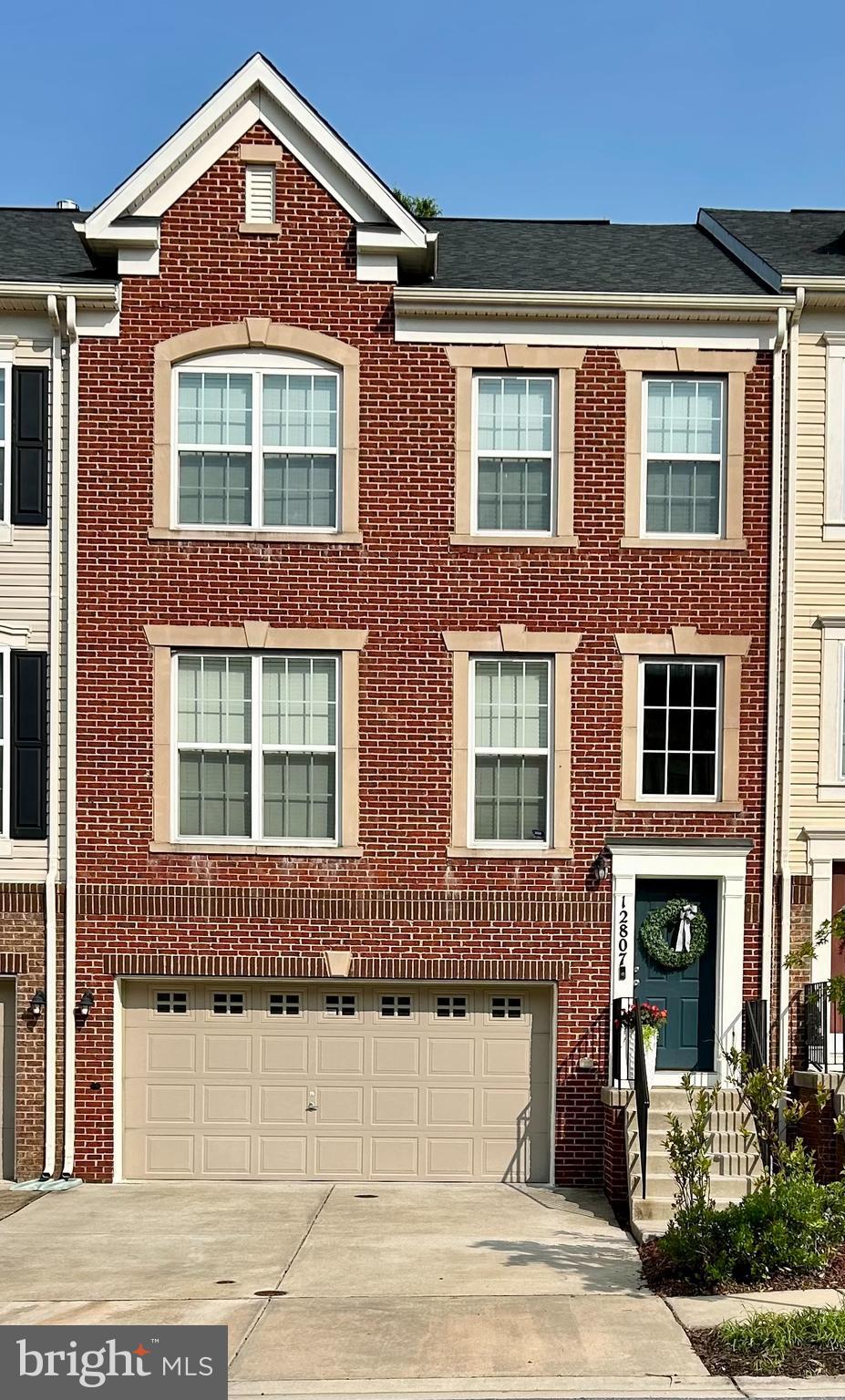 Back on The Market!! This brick townhouse has the best location in BRICK YARD STATION. It backs to trees with plenty of privacy. It has a two car garage plus additional parking for two cars in front of the garage. The three level home features an open concept of the kitchen, living room, dining room and family room area. It has high ceilings and wood flooring. It also has a large island area in the kitchen for additional seating, stainless appliances and faucet. A spacious pantry and plenty of cabinet space along with granite counter tops. There is a large maintenance free deck past the sliding glass door that allows for relaxation and privacy with plenty of trees behind it. There's also a powder room located on the main level. The home has just had brand new carpeting installed and has been freshly painted. The bedrooms, laundry area, hall full bath and a primary bedroom with a full bath are located on the second level. The basement level Rec room along with a full Bath is great for multiple activities, which is located right behind the two car garage. You'll also have access to the community club house, pool and exercise facilities. Come take a look at the wonderful home...
