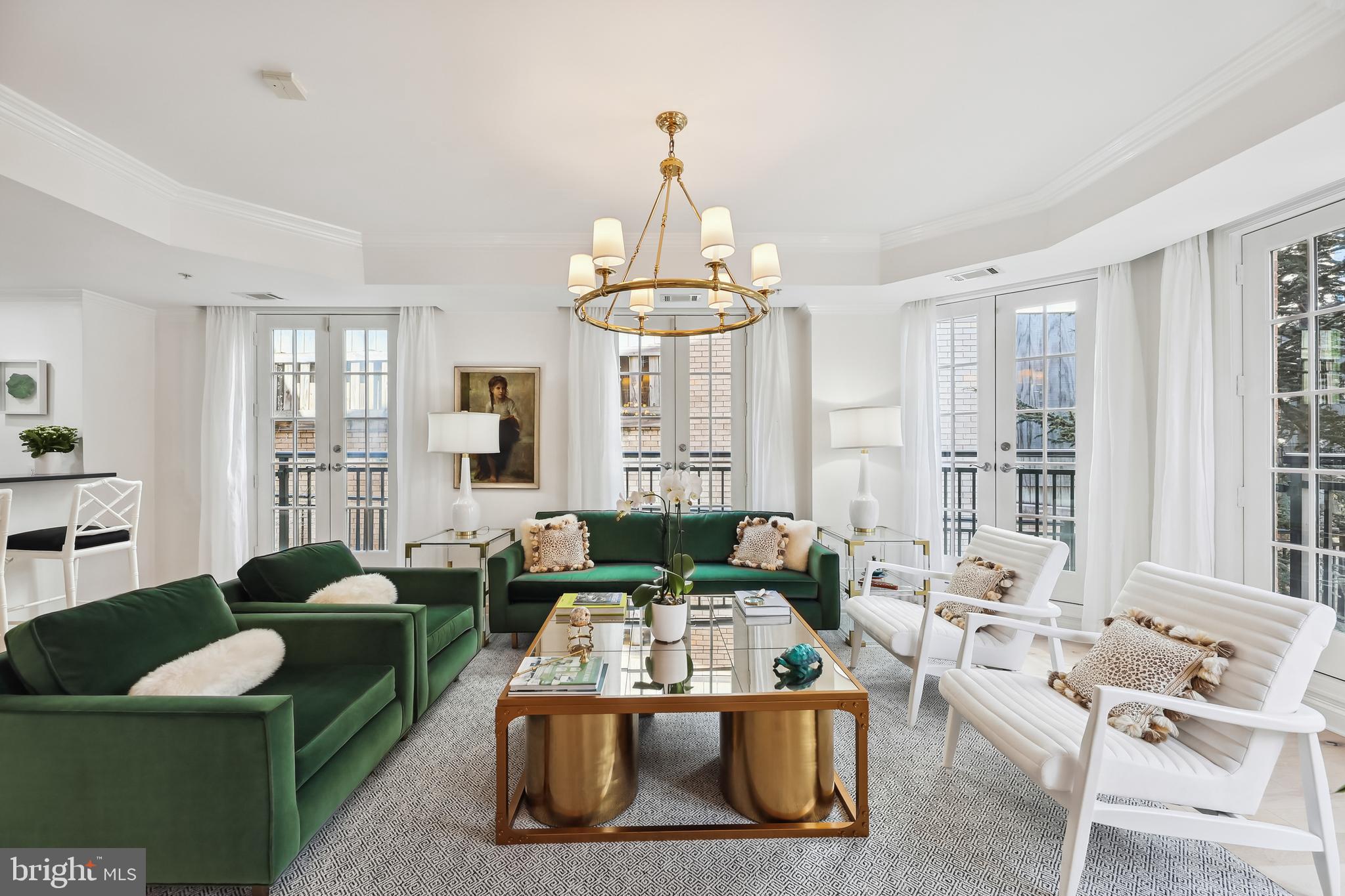 Rarely available in Georgetown Heights, a uniquely located luxury boutique building. This absolutely exquisite 2 bedroom, 2.5 bath unit is worthy of a spread in Architectural Digest. The unit is larger than tax records suggest. It has been redesigned and fully renovated by a talented interior designer. It has been thoughtfully redesigned to maximize space and create a soothing ambiance. The lovely entry foyer welcomes you into the open and spacious living area with a separate elegant dining room. The white kitchen is outfitted with a Viking professional gas cooktop and wall oven. Instead of windows, the unit features almost a dozen french doors that open and overlook the beautiful courtyard below. The powder room is a gem. The washer and dryer closet includes storage space. TWO parking spaces and TWO storage units convey with the unit. The pet friendly building with concierge boasts an incredible rooftop with 360 views of the city, comfortable seating and dining areas plus grills for its residents. This stunning unit is one of only four on a private section of the second floor.