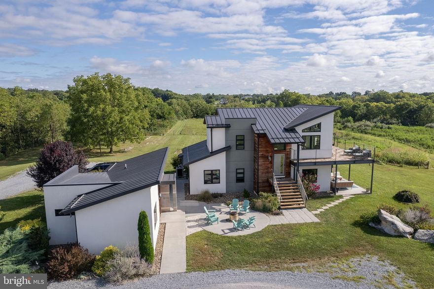 Welcome to the farm where the land has been organically kept, animals have been rotationally grazed, and wildlife abounds!

This property has it all!  Views, Location, Acreage, Pond, Additional DUR, Home and Cottage!
This exceptional property offers over 75 acres of natural beauty, complete with a pond, a stream (Long Marsh Run), 2 high-tensile fenced paddocks, Approx. 30 tillable acres, Old Barn with electric and water spigot, and an above-ground pool ( owner can remove)  
The main residence features 4 bedrooms and 2.5 bathrooms, almost 3000 sq ft, including the cottage.  Thoughtfully designed with spacious 9-foot ceilings and a cathedral ceiling in the main living area. Clean, modern finishes include frameless doors, solid-core 7-foot doors, all complemented by engineered oak flooring throughout. Adjacent to the main home is a versatile 600-square-foot building complete with a full bathroom—ideal for a private office, guest house, or in-law suite. 
1 EXTRA DUR (Dwelling Unit Right)

At the heart of the home is a gourmet kitchen designed for serious cooks and entertainers alike. It boasts a Wolf 60" dual-fuel six-burner range with infrared dual griddle and pot filler, a Sub-Zero refrigerator with freezer with built-in ice maker, a Bosch dishwasher,  a Kohler Stages 45" stainless steel undermount sink SilentShield, and a pull-out corner cabinet and drawers, completing this high-end culinary space.

Outdoor living is equally impressive, with a 940-square-foot IPE wood wraparound deck and an 892-square-foot covered patio featuring a tongue-and-groove walnut ceiling—perfect for entertaining or simply enjoying the views and serenity. Long Marsh Run flows through the property. Plenty of space for horses, cows etc.. bring your animals!
The property offers a  rare opportunity to enjoy edible landscaping at its finest, featuring a wide variety of established fruit trees and plantings, including walnut forest right in your own backyard! Imagine stepping outside to harvest fresh produce throughout the seasons—perfect for healthy living, homesteading, or simply savoring nature’s abundance.

Efficiency and comfort are built into every aspect of the home. A high-efficiency heat pump with a fresh air make-up energy recovery unit ensures year-round comfort, while a 500-gallon propane tank . The home also features an on-demand  propane water heater, with a gas line roughed in for a future grill. Additionally, conduit is already in place for a future garage pad and firepit area.

Modern connectivity is no issue thanks to Viper Broadband satellite service which is one option that the owners chose, allowing you to enjoy the best of both worlds: expansive rural acreage with high-end finishes and reliable modern conveniences.  

This is a rare opportunity to create the lifestyle you’ve been dreaming of—room for animals, space to grow, water features, established orchards, and a home designed to last.  Check out our 3-D Tour attached to the listing!
PLEASE DO NOT DRIVE UP THE DRIVEWAY WITHOUT AN APPOINTMENT AND YOUR REALTOR**