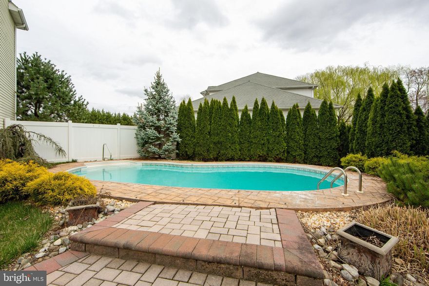 105 Jakes Way, Feasterville, Timeless Elegance Meets Modern Comfort.  Nestled on a quiet cul-de-sac in a highly sought-after Feasterville neighborhood, this beautifully maintained 4-bedroom, 2.5-bath home immediately captivates with its classic façade, lush landscaping, and pristine curb appeal.  The fully fenced backyard is a private oasis featuring a saltwater pool surrounded by elegant pavers—perfect for summer gatherings and entertaining guests in style.  Step through the grand entrance into a stunning two-story foyer with a dramatic natural stone floor and a curved staircase that adds a touch of sophistication and timeless elegance.  The open and airy main level boasts rich hardwood flooring, recessed lighting, and a flowing floor plan ideal for daily living and entertaining.  A formal living and dining room leads into the heart of the home—an expansive gourmet kitchen equipped with stainless steel appliances, ample cabinetry, and generous counter space that opens to a cozy family room with a fireplace.  Upstairs, the luxurious primary suite features a cathedral ceiling and a spa-inspired en suite bath adorned with real stone, jacuzzi, and separate shower.  Three additional generously sized bedrooms share a beautifully appointed full guest bathroom, providing ample space and comfort for family or visitors.  The fully finished basement is a versatile retreat with rich wood-look flooring, custom lighting, and multiple living zones—perfect for a home gym, media area, playroom, or home office.  There's ample space to relax, work, or entertain, all in a thoughtfully designed layout that maximizes functionality.  An attached two-car garage and oversized driveway add convenience, while the prime location places you just minutes from top-rated schools, shopping, dining, and major commuter routes.  This move-in-ready gem offers inside and out luxury, space, and style.  Schedule your private tour today and experience the best of suburban living!