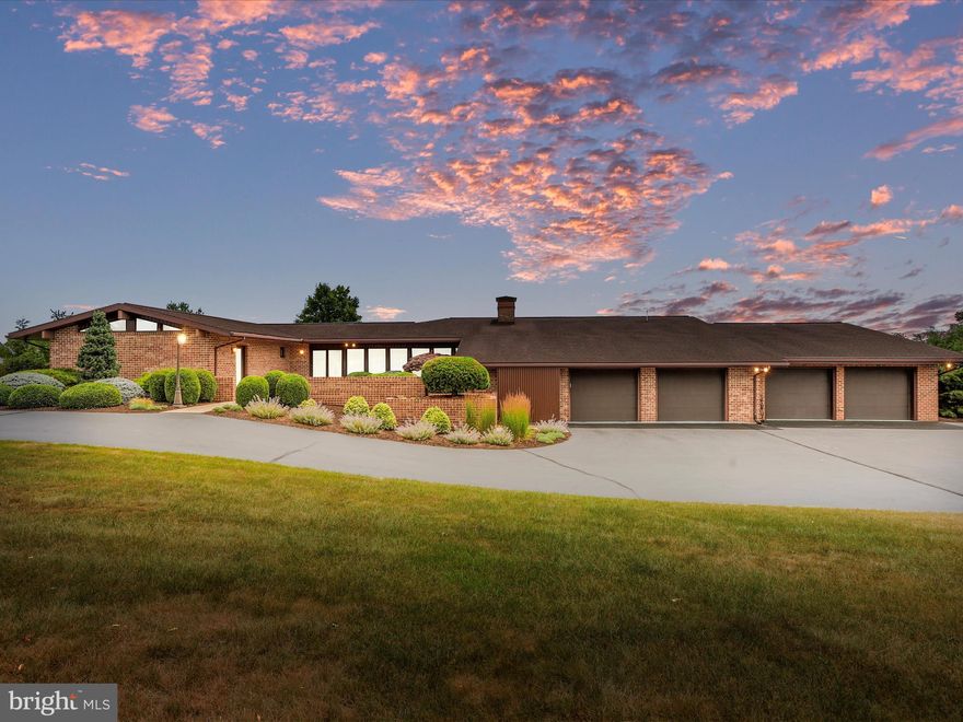 Looking for space?  This home offers just that!  Situated on 5.24 acres of lush grass  is a gorgeous home that is packed full of surprises!  This home features a mid century modern vibe throughout and offers 3 generously sized bedrooms, 3 full baths and a half bath!  There are 2 bedrooms that could easily be used as primary bedrooms with outside access to patio space from each, and vaulted ceilings!  Updated bathrooms offer custom natural cherry cabinets and beautiful finishes!  The main living area has so much space to offer!  The kitchen has custom made natural cherry cabinets, quartz countertops, stainless appliances and a seating area and is open to a family room with propane fireplace, to the opposite side of the kitchen  you will find a dining area and additional living space with full glass patio windows and doors to take in the breathtaking views of the rolling landscape behind the home.    There is also a game room with an office with access and views of the patio space that is home to a redwood pergola.  The pergola features rolling awning shade to make your outside entertainment even more enjoyable!  The office space has custom oak built in cabinets / display areas and a lot of storage!  Just when you thought you had seen it all, there is an amazing garage, sure to delight any car enthusiast!  The garages are divided into a 2 car and a separate 4 car space, where you will find plenty of room to work on cars or create a workshop space to make others envious!  In this space is where you will find the third full bath!  There are 3 water heaters to insure that you never run out of hot water!  Above the garage space (access through the game room) is a great storage area that you just don't find in many single level homes! 
 This homeowner has thought of everything and you can tell in the care of the home how much they value ease and great property condition!  There is nothing that needs done!