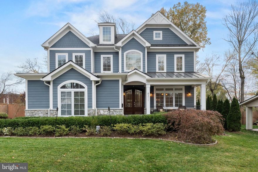 Welcome to this beautiful home in the Dunn Loring Woods subdivision of Vienna Virginia. This custom home features a 3 car, side load garage with Tesla Charger, a flat fenced in backyard with paver patio and gas hardline firepit, deck with retractable awning & gas line for your grill, a wonderful front porch & 5 bedrooms, 5.5 bathrooms on three finished levels totaling just over 6,000 sqft. Gleaming hardwood floors greet you and are throughout the main and second level. Open concept living makes this home perfect for entertaining! The gorgeous gourmet kitchen features Kitchen Aid stainless steel appliances (gas stove and electric wall oven), granite countertops, tile backsplash, walk in pantry, & butler's pantry with fridge. The family room is opposite the eat in kitchen and has a cozy gas fireplace and stunning coffered ceiling. The office is tucked away next to the family room and finishes off the main level. Every bedroom enjoys its own En-Suite, a walk-in closet and hardwood floors. A loft sitting room next to the two-story foyer is a great place to relax and read a book or take a nap. The convenient bedroom level laundry has tons of storage and a sink for those pesky stains. The primary bedroom does not disappoint with a sitting area,  trey ceiling, two walk in closets, and a spa bathroom with a very, very large shower and separate jetted tub. The walk up basement has so many options on how to set it up because it has tons of space! It also features a full wet bar with full size fridge and lots of cabinet storage. The legal bedroom and full bathroom room also give you the option of having the basement as a separate space to be used by in laws, au pairs or whomever you like! Do not miss the video tour in the listing! Welcome and Enjoy!