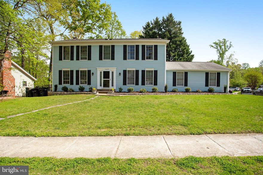 3 Finished Level Colonial * Completely Updated * Remodeled Kitchen * Upper Level features huge primary Bedroom * 3  Other very spacious bedrooms all upstairs with Laundry upstairs!  Main Level has separate Living and Dining rooms, Huge family room with Fireplace and French doors to Huge deck!  Lower level has large common area with a 5th Bedroom and full bathroom that has a walk out to a completely fenced backyard.  New HVAC with a 10 yr maintenance  plan!