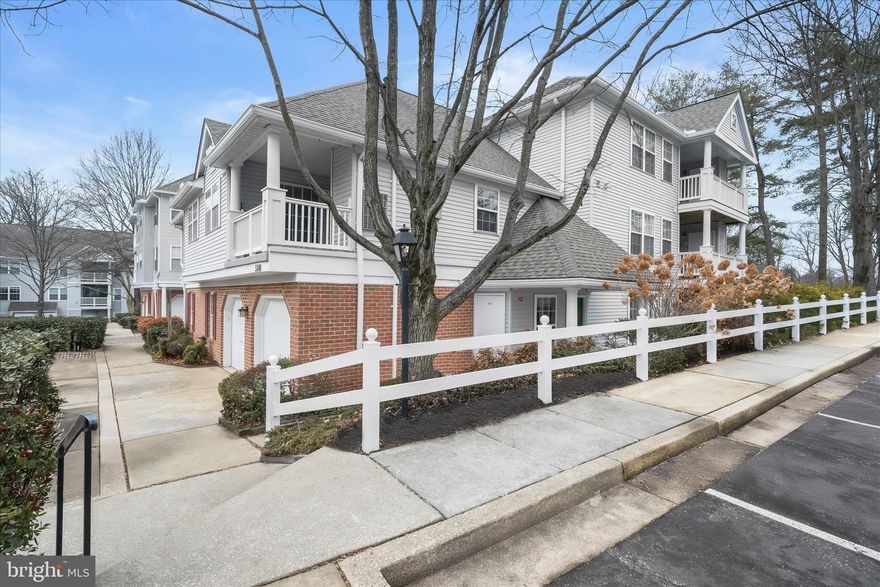 Nestled within the desirable Wyndham at Town Center community, this beautifully updated condominium offers comfort, style, and convenience. Step inside to an open, airy layout where the living room welcomes you with soaring ceilings, a cozy gas-burning fireplace, and plush new carpeting that flows seamlessly into the dining area. Perfectly positioned with access to both the balcony and kitchen, the dining space is ideal for effortless indoor and outdoor entertaining.  The kitchen is thoughtfully designed with modern flooring, ample cabinetry, generous prep space, a pantry, and stainless steel appliances. Retreat to the spacious primary bedroom featuring an elegant French door entry, double closets, and direct access to a dual-entry bath complete with a double vanity and soaking tub. An additional bedroom and a one-car garage complete this inviting home.  Ideally located near major commuter routes including I-29, MD-32, and I-70, this residence offers easy access to shopping, dining, and entertainment at Columbia Mall and live performances at Merriweather Post Pavilion, with convenient travel to Washington, D.C., and Baltimore. A wonderful opportunity to enjoy low-maintenance living in the heart of Howard County.