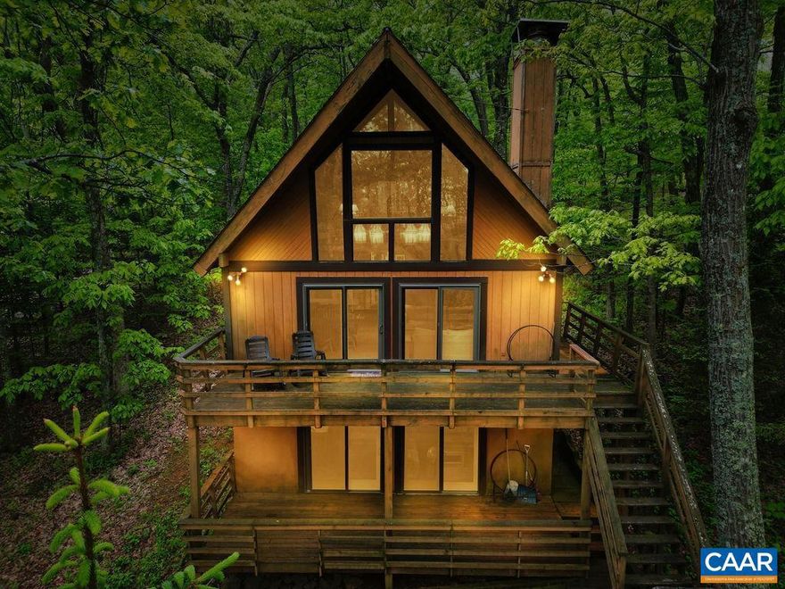 Welcome to this charming mountain chalet! Designed and built by the owners, this home has been the family's favorite getaway for years. Located at a short walk from the ski slopes and several hiking trails, the property also offers seasonal sunrises and mountain views. You will find ageless charm here. Beautiful cedar paneling, cathedral ceilings, an A-frame great room, stone wood burning fireplace, open concept, two large decks, and a stunning chandelier. This gorgeous chandelier in the great room resided originally in The Freemason Abbey in Norfolk, built in 1873, now a tavern. And now is the focal point of the Wintergreen home. The owners designed the house to accommodate large gatherings. Between the 6 bedrooms and the loft, you can sleep 16 people comfortably. Separation of generations or family is also very convenient as both main levels offer a full kitchen, a living room, and a dining area. This home lives much larger than its 2,266 sqft. Many substantial upgrades have been made to the property in the last 10 years including all new windows and exterior doors, new carpet, new interior paint, kitchen cabinets and appliances on the 2nd level, new toilets, sinks, wood stove, replaced plumbing from the street to the house.,Formica Counter,Maple Cabinets,Fireplace in Family Room,Fireplace in Great Room