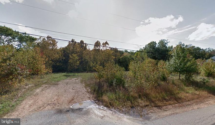 Welcome to this lovely buildable lot, eagerly awaiting the realization of your dream home.