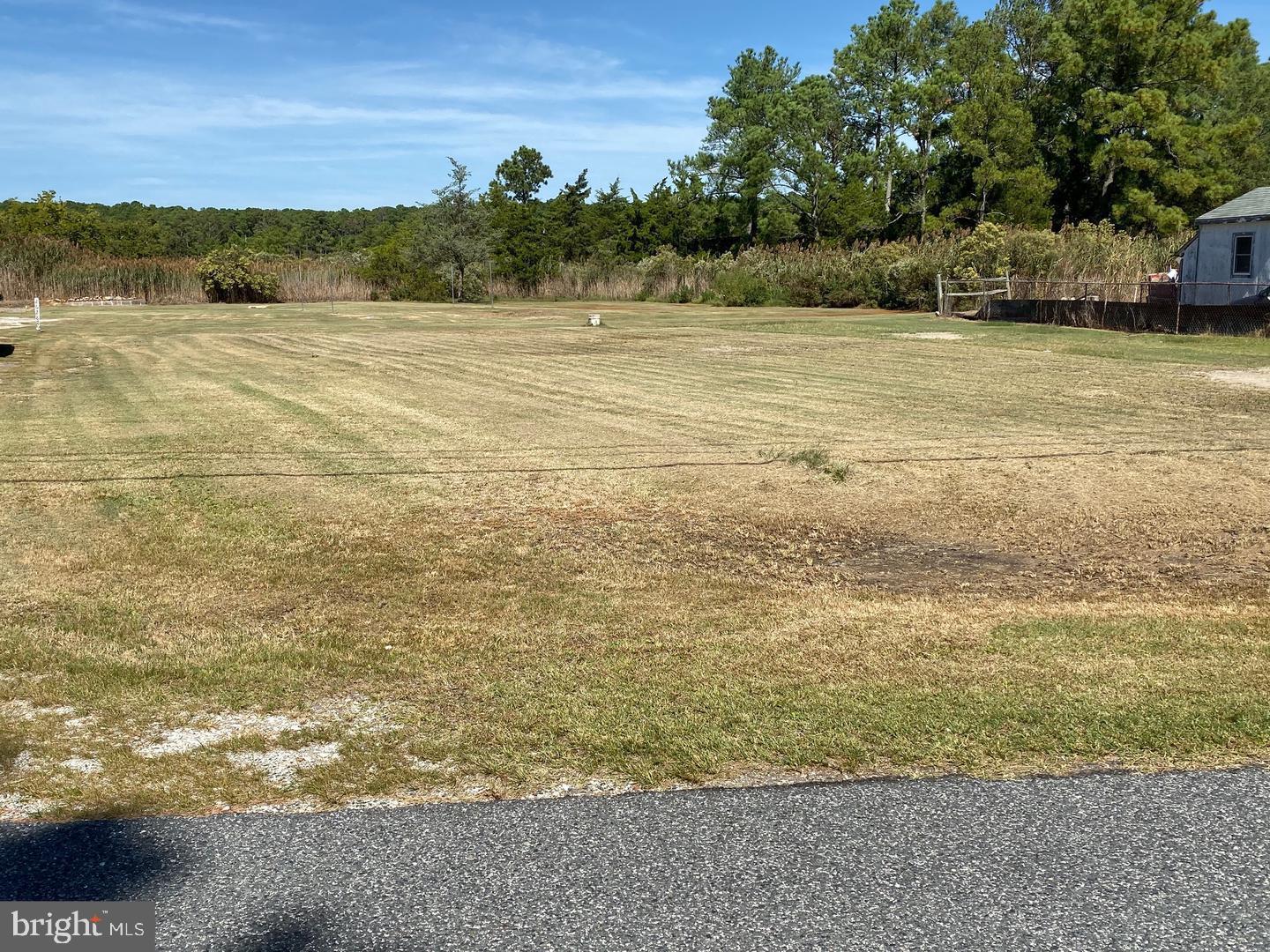 Building lot outside of Crisfield city limits - no city taxes but still has the amenity of city water and sewer! Even better the sewer hookup fee has already been paid!! Soil evaluation has been completed; all ready to start building your dream home. Close to Janes Island State Park, Wellington Beach, and public boat ramps—perfect for those looking for a low maintenance shore vacation spot and love the Chesapeake Bay outdoors.