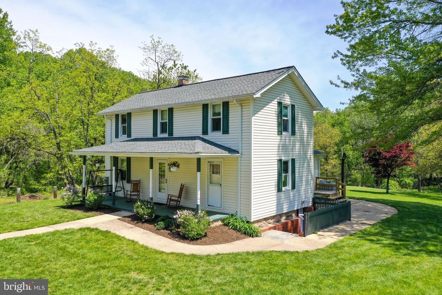 This timeless treasure brings you back to a time where evenings were spent rocking on the charming porch after a hard day's work, and nature would sing your cares away.  Your own personal and private paradise awaits!  This home was re-built circa 1923 and then renovated along with an addition in 1979.  This home presents you with wood floors throughout most of the home, large country kitchen, 1st floor master with master bath, complete set up for offices in lower level with separate entrance, or plenty of room to create recreation space and family gatherings.  This list of upgrades is extensive to include new well pump in 2020, new roof in 2017, new vinyl siding in 2017, new gutters and gutter guards/downspouts in 2017, new shutters, soffit vents and rake boards 2017 - complete list of history of improvements available with disclosures.  The property includes a historical hand hewn beam barn/Carriage Barn with loft and stone foundation; Two Horse Stall barn with water, electric, hay loft and steel framing; Large shed with concrete floor and electric, Shop with electric, fuel oil furnace with above ground fuel tank, concrete slab, air compressor and air lines; Contractor trailer, Shed with Double Doors, 13000 Watt Back-up Generator and Generator Shed, Grape Arbor, Garden plot where rain barrels with gravity flow waterline irrigate the fenced in garden plot, Freeze proof red shed and so much more!This property is also subdividable and has two additional lots for sale under the "Land" section of the MLS.