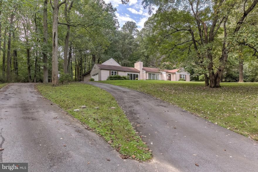 Beautifully Updated Rancher w/ 2-Car Garage sits on 1.75 Acres! This home boasts a huge master suite w/ 2 walk-in closets, cathedral ceilings, dressing nook, gorgeous spa-like bath w/ soaking tub, & walk-out to back deck. Wd floors throughout, custom made barn-doors, updated kitchen w/ sitting room, 2nd MSTR bedroom w/ updated bath, spacious LR w/ WDBFP & surround sound, LL Family Rm w/ 2nd WDBFP.