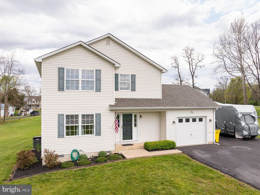 Don’t miss this charming colonial home on 1.13 acres in Bunker Hill! This property is located on one of the largest lots in the neighborhood and features a large yard perfect for entertaining and a long driveway with plenty of parking. Inside, you will find an open floor plan with a living room and half bathroom just off the foyer as well as vinyl plank flooring throughout the home. The kitchen offers stainless appliances, built-in microwave, dishwasher, pantry, and a beautiful view from the sink window. Just off the kitchen is a formal dining room with plenty of sunlight. Entertain guests or soak up the sun on the rear deck located just off the kitchen. The main level also features a laundry room and access to the one car garage. Upstairs, you’ll find a primary bedroom with a walk-in closet and a primary bathroom. There are two additional bedrooms upstairs that share a hall bathroom. Buy with peace of mind as this home has had many updates over recent years including a new roof, paved driveway, flooring, appliances, storm doors, HVAC (2021), and more. This home is conveniently located just minutes from the Virginia line and I-81 for an easy commute to VA or MD.