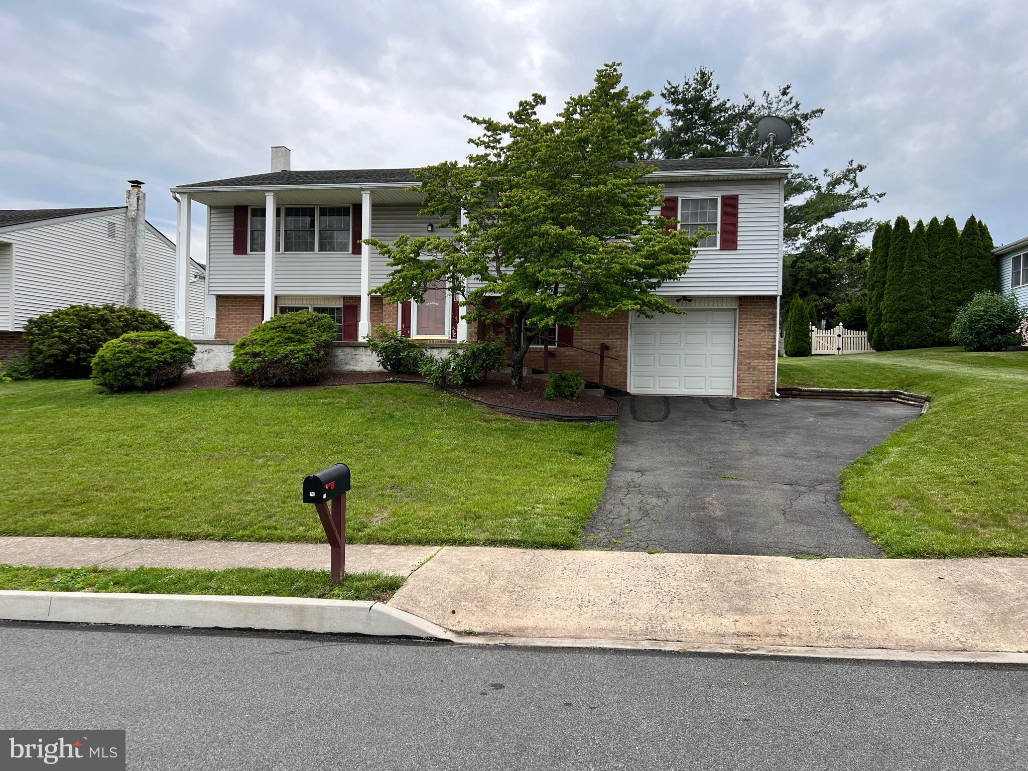 This just listed "Presidential Estates" dwelling features 4 Bedrooms, 2-1/2 Bathrooms; a rear Deck accessible from sliders in the dining area or outside via a stairway; huge Recreation Room with a brick hearth and wall thimble for an auxiliary heating stove; Central Air-Conditioning; Utility Room with a newer washer and dryer; built-in Garage, plus much, much more, so don't wait to schedule your appointment. Showings begin on Sunday, June 1st. Please note that all numbers, measurements, and/or dimensions are approximations only and buyer should verify and satisfy self. The property is clean and in good condition, but it is being sold "as-is".