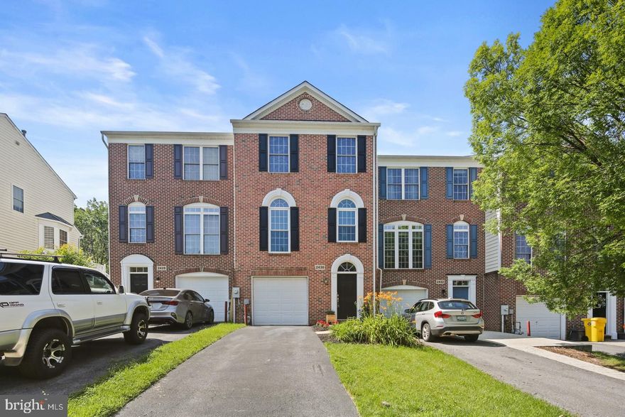 Tucked away in the sought-after Chapel Grove community, 2430 Jostaberry Way offers the perfect blend of comfort, flexibility, and privacy. This beautifully maintained townhome spans over 2,300 square feet across three finished levels and backs to a peaceful wooded backdrop, giving you the sense of a quiet retreat while staying close to everything you need. Inside, the entry-level welcomes you with a spacious rec room, a full bathroom, and a versatile bonus room—perfect for a guest space, home office, or an additional bedroom. Step out to the fully fenced backyard with a lower-level patio, ideal for grilling or enjoying the view. Upstairs, the main level is drenched in natural light thanks to tall arched windows and bump-outs that expand the living space on all three floors. Gleaming floors lead you into the open-concept layout featuring a gourmet kitchen with granite countertops, stainless steel appliances, a double oven, and a large center island with a gas cooktop. Just off the kitchen, the dining area opens to a private deck with wooded views—great for morning coffee or unwinding after work. A bonus room with French doors offers a perfect space for a playroom, home office, or reading nook, and a convenient half bath completes the level. The top floor offers two spacious suites, each with its own full bathroom. The primary suite impresses with vaulted ceilings, dual walk-in closets, and a bright en-suite bath with a soaking tub, separate shower, and double vanities. Recent updates include a new water heater, new dishwasher and newly installed, energy-efficient windows with a transferable warranty. This home also includes an attached garage, a two-car driveway, and access to fantastic HOA amenities like a community pool, tot lots, and well-maintained open spaces. With close proximity to Waugh Chapel shopping, Fort Meade, the MARC station, and top commuter routes, 2430 Jostaberry Way checks every box for location, lifestyle, and long-term value.