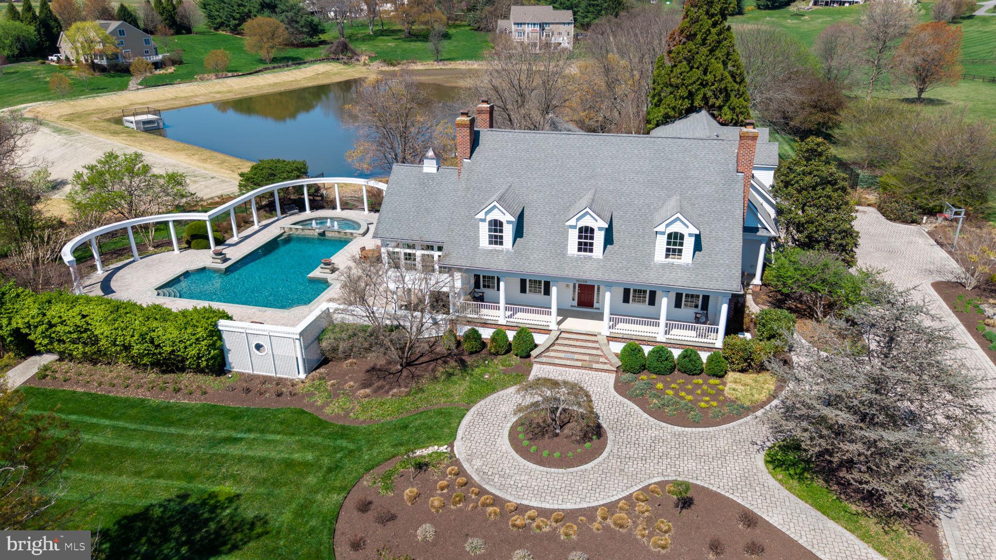 Unmatched Luxury in Western Howard County
This is a RARE opportunity to own one of Howard County’s most exclusive estates! Nestled on 5 pristine acres, this One-of-a-Kind Southern Cape Cod masterpiece redefines luxury living with 5 generously sized bedrooms, 4.5 bathrooms, and exceptional indoor-outdoor spaces that elevate every lifestyle.
From the moment you arrive, you're welcomed by award-winning landscaping, a grand concrete paver driveway, and a wide Southern-style front porch that opens to a stunning foyer wrapped in fresh 2024 designer paint and gleaming refinished cherry hardwood floors throughout.
The heart of the home continues to impress with a fully finished on-grade basement complete with its own kitchen ( perfect for in-law or guest accommodations) , a professional 9 -foot pool table, and a dedicated movie room featuring leather recliners, projector, and screen that all convey.
Outside, your private paradise awaits. The 1.5-acre, fully deeded private pond—fresh off a $1.5M reconstruction in 2024 by Howard County Contract #D-1177—is stocked with bass and ideal for your PRIVATE fishing or canoeing experience. Cascading waterfalls and a koi pond feed into the pond, creating a tranquil backdrop for everyday living or unforgettable events.
The resort-style outdoor living space features an expansive heated saltwater pool with new (2025) primary pool pump, spa, and fiber-optic lighting with adjustable colors, plus brand-new fire bowls (2025) for a truly dramatic, one of a kind nighttime experience. Entertain in style on the upper-tiered patio with a full outdoor chef’s kitchen, complete with Viking appliances, a wok, dual sinks, grill, two-burner stove, ice machine, and kegerator.
Additional outdoor highlights include:
New whole-house generator and transfer switch ( winter 2024)
Outdoor sound system
Extensive low-voltage LED landscape lighting (all bulbs replaced in fall 2024)
Backyard walking paths and gardens
Fenced area perfect for a playground or volleyball court
Other recent major updates:
Primary kitchen refrigerator (2024)
Main and basement level HVAC system replaced (2019)
Well pump replaced (2017)
This estate is not just a home—it's a lifestyle. Located in prestigious Western Howard County, it offers unparalleled seclusion, timeless charm, and modern convenience all in one exquisite package. Whether you're hosting a grand celebration or enjoying a peaceful evening by the pond, this property is truly unmatched.
Do NOT miss this once-in-a-lifetime opportunity to own one of the finest private residences in Howard County.
Call Rebecca Mason at Cummings & Co today for your private tour!