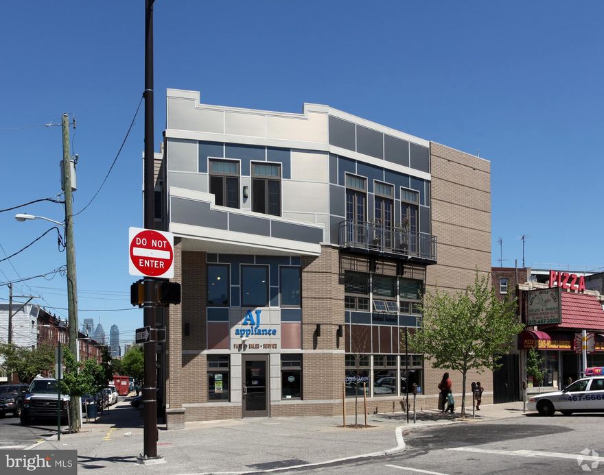 Welcome to 1437 W Passyunk Ave! This 10,000 SF multi-use property is the perfect opportunity for any business owner or investor. 1437 W Passyunk was built from the ground up in 2011 by the current owners, who use the first two commercial floors for their business and live above on the third and fourth residential floors. Positioned on the corner of 15th and Passyunk, the property is zoned CMX-2, allowing for a multitude of end-users.  The property’s corner location, and large first-floor windows allow for tons of exposure to both walking and vehicular traffic. The property consists roughly of 5,200 SF of commercial space and 4,800 SF of residential space. The first-floor commercial space, which is open layout, is currently used as a retail/showroom. Take the spiral stairs up to the mezzanine level overlooking the first floor, which is great for additional seating, flex space, or can be converted to offices. Through the mezzanine doorway, or by taking the back elevator access, you will enter a large room that is currently used as office space. There is a private conference room, two private offices, a kitchen and dining area, and two restrooms. The last piece of the commercial space is the basement, roughly 1,700 SF of space, perfect for storage. Thanks to separate entrances/exits and private staircases, the commercial space can be divided and used by one or two tenants. On 15th street lies the residential entrance and two car garage. Take the elevator or private residential staircase up to the third and fourth floor luxury apartment, which includes two bedrooms, two full and two half bathes.  Hardwood flooring and stunning high-end finishes flow throughout the apartment, as well as tons of natural light thanks to the numerous windows and juliette balcony doors. The Chef’s kitchen is entirely custom and includes intricate details such as two sinks, a large subzero refrigerator, built in espresso/coffee machine, Wolf gas range, dual ovens, full pantry, island and bar seating. Just off the kitchen lies a spacious spare bedroom with full bath. The primary suite has two walk-in closets, a small patio, and a full bath with walk-in glass shower and separate soaking tub. Just off the primary suite is the laundry room. A half bath and extra closet space bring you back around to the elevator. One floor up lies a spacious roof deck with 360-degree views. Listed for sale at $2,300,000, this property could be yours to live and work in, or live and lease out to one or two commercial tenants. The commercial space is also available for lease – please reach out to the listing agent for more information or inquiries.
