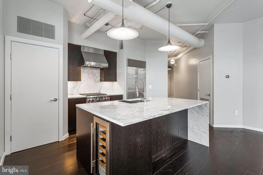 **OPEN HOUSE CANCELED SEPT. 14 - APPLICATION PROCESSING FOR APARTMENT**

 Recently renovated with high-end, thoughtfully designed finishes, this 2-bedroom, 2.5-bath condo in Station Square offers modern sophistication and urban convenience. The loft-style residence boasts soaring 10-foot ceilings, gleaming hardwood floors, and elegant marble bathrooms. A chef’s kitchen features Wolf and Sub-Zero appliances, perfect for both entertaining and everyday living.
With over 1,300 square feet of living space, this home includes walk-in closets, dedicated parking, and a layout that combines comfort with style. Just one block from the Clarendon Metro, residents enjoy unmatched access to Trader Joe’s, Whole Foods, dining, and nightlife.
Station Square offers resort-style amenities including a fully equipped gym, inviting pool, and billiards room, making this home the complete package in one of Arlington’s most vibrant neighborhoods.