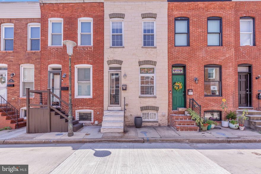 Updated Rowhome Steps from Patterson Park!  Enter to Living Room with Wainscoting and Exposed Brick.  Hardwood Flooring Throughout First Floor, Stairs, and Upper Hallway.  Formal Dining Room with Built in Shelving & Serving Area.  Updated Kitchen Features Granite Counters, Upgraded Casework, Stainless Appliances, and Island with Seating.  Upstairs find 2 Nicely Sized Bedrooms with Great Natural Light and Berber Carpeting.  Ceiling Fan in Primary Bedroom.  Updated Upper Full Bath with Jetted Tub, Tile Surround, and Three-Way Mirrored Medicine Cabinet.  Finished Lower Level Features Den, Full Bath with Walk-In Shower, and Stacked Laundry.  Rear Patio fully Paved with Alley Access - POTENTIAL FOR PARKING!  Literally 50 yards from Patterson Park – the ultimate in Walkable Locations!
Sump Pump apx 2 years old.  HWH, Furnace, AC & Roof in good repair, however exact age is unknown.   Mortgage savings may be available for buyers of this listing.