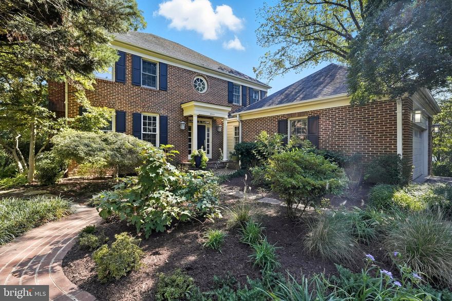 Welcome to this spacious residence offering over 4,250 square feet of beautifully designed living space, nestled among mature trees.
Step through the grand entry foyer into a stunning center hall with a sweeping staircase, setting the tone for the gracious layout throughout. The main level features a formal living room and an exquisite dining room adorned with designer wallpaper—perfect for entertaining. A sun-drenched family room with custom built-ins, recessed lighting, and large windows invites warmth and relaxation, with direct access to a serene back deck shaded by a canopy of trees.
The heart of the home is the newly updated chef’s kitchen, featuring a central island with quartz countertops, top-of-the-line appliances, glass tile backsplash, modern lighting, and a cozy breakfast nook with a fireplace. Just off the kitchen, a newer mudroom with custom cabinetry connects to the spacious two-car garage.
A main-level office with patio access and a sleek new powder room with designer finishes complete the first floor.
Upstairs, the luxurious primary suite offers a wall of custom built-ins, a walk-in closet, and an ensuite bath with a separate soaking tub and shower. Two additional generously sized bedrooms, a full bath, and a convenient upstairs laundry room provide ample comfort and space.
The finished lower level includes a large recreation room, an additional bedroom and full bath—ideal for guests or extended family—plus abundant storage and access to a lower patio and fenced backyard.
This exceptional home combines classic architectural details such as crown moldings, hardwood floors with thoughtfully updated features throughout like recessed lighting. From the inviting outdoor spaces to the elegant interior finishes, this is a rare opportunity to own a truly move-in-ready home in a beautiful, tranquil setting in the City of Alexandria.